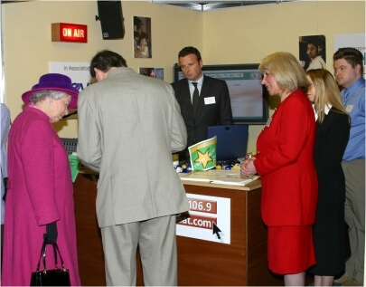 Her Majesty the Queen with Robert Owen visiting the hertbeat FM booth. Stevenage 2002